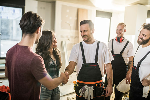 3 tradespeople with clients
