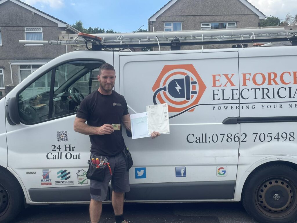 Man stood in front of a van holding his qualification obtained from Electrical Courses Ltd having become an electrician