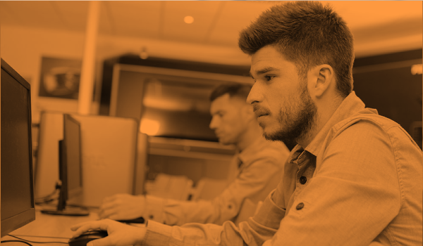 Comprehensive free learning platform launches for UK electrical apprentices - men using computers