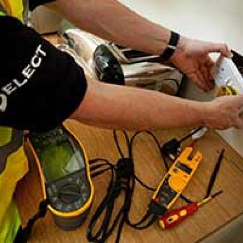 A SELECT electrician fitting a plug
