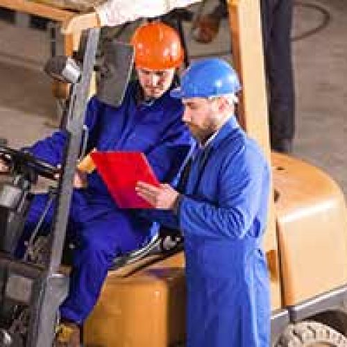 Workers reading the Hogan Safety Assessment