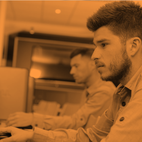 Comprehensive free learning platform launches for UK electrical apprentices - men using computers
